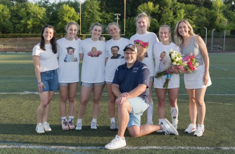 The five Wilsonville Girls Lacrosse seniors posing for a picture with their coaches. The Cats would go on to win this game 16-4.