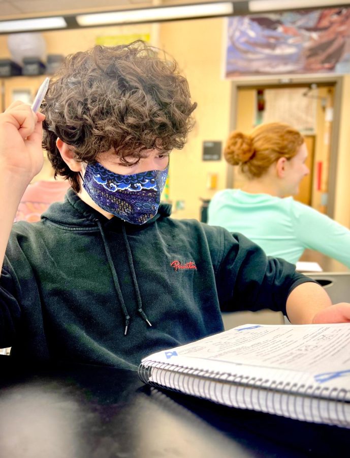 Xander Povey spends some extra time before his AP Chemistry exam looking over his notes. He has a bit more time to study after not attending the prom over the weekend. 