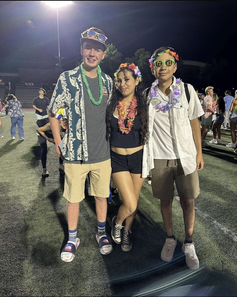 Seniors Hector Baltazar, Venecia Gonzalez, and Trenton Bonfiglio at the home game against Thurston. They kicked off the first football game of the season by displaying their Wildcat pride.