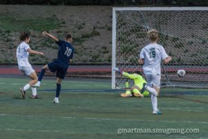 Junior Forward Alex Aguiar knocks in an early goal in a game against West Linn. Wilsonville opens league play at Parkrose on Tuesday, September 26th at 7:00 PM.