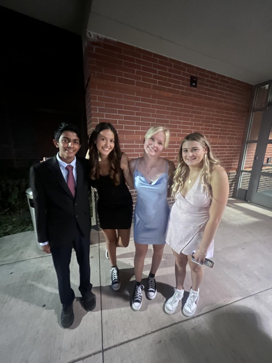Left to right: Arush Goswami, Audrey Buck, Lily Arzie, Gabby Maoz pictured with their previously worn homecoming attire from the 2022-2023 school year.