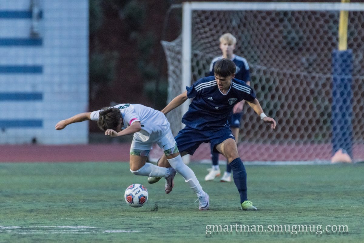 Junior Midfielder Sergio Day challenges a West Linn attacker. Day and the Wildcats play Hood River Valley Wednesday, October 11th. Photo provided by Greg Artman.