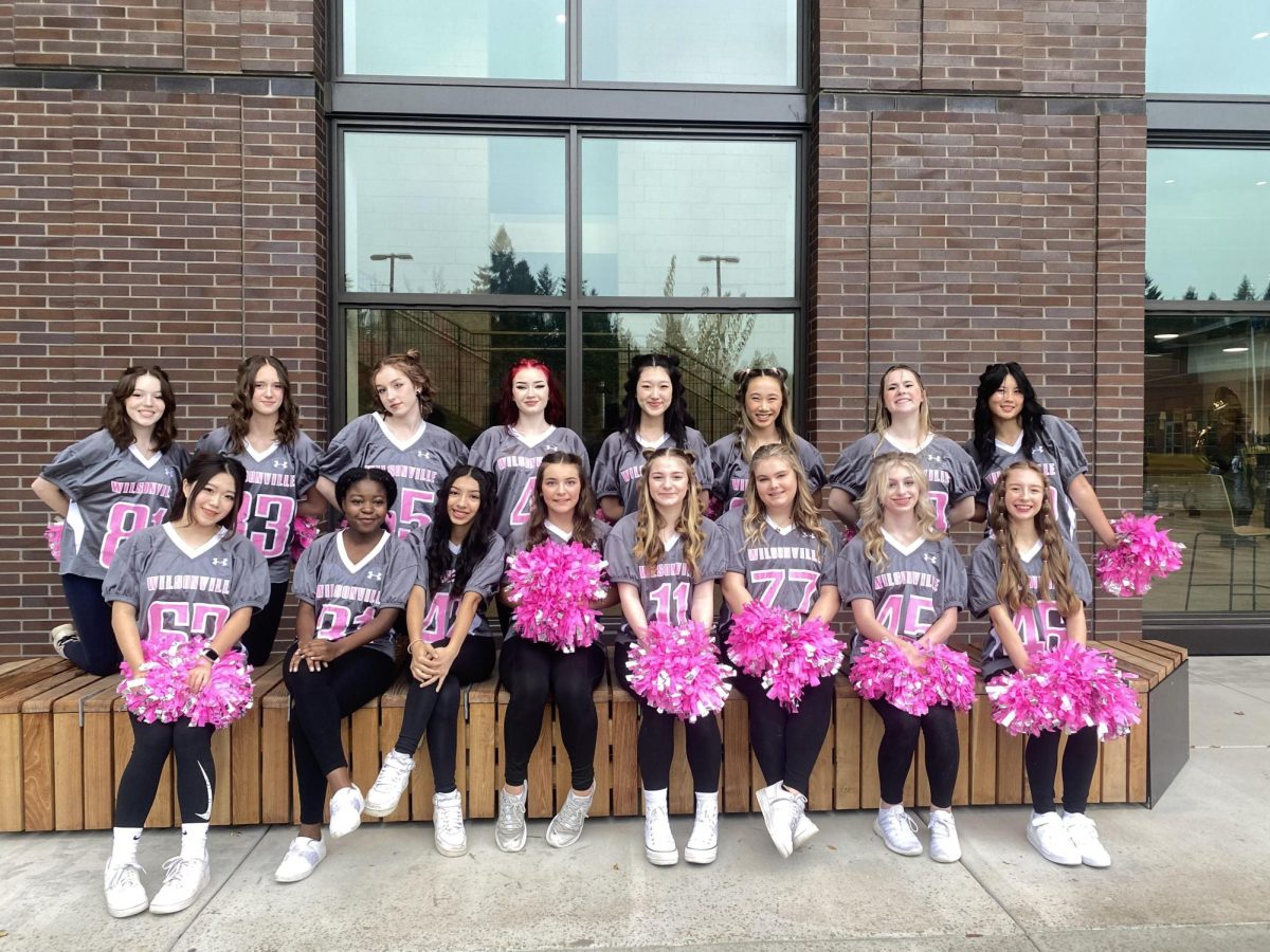 Dance team prepares for homecoming parade where they performed a mini pom performance. The performance was choreographed by the team captains. Photo provided by Cassie Markstaller.