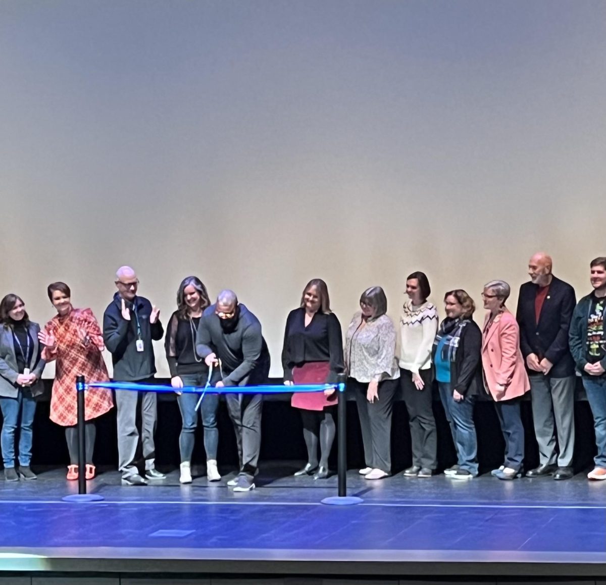 Members+of+our+community+join+on-stage+to+perform+the+ribbon-cutting.+Shortly+after%2C+students+hosted+tours+and+asked+any+lingering+questions+the+attendees+had.