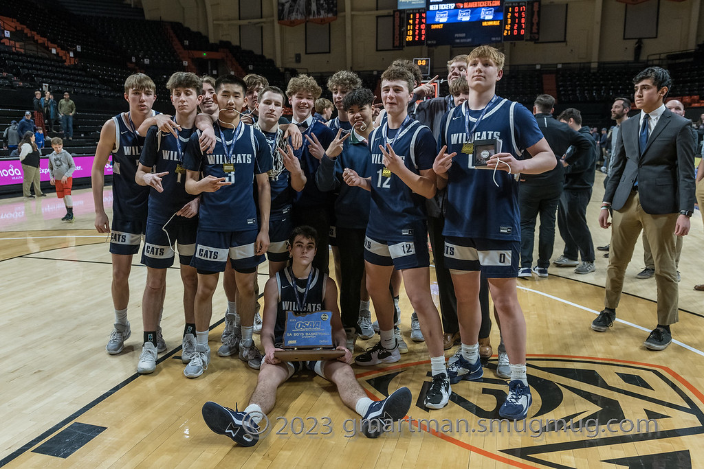 The Wilsonville basketball team poses for a picture after winning the 2023 State Championship. Wilsonville took down Summit 43-36 in their second straight title victory. Photo provided by Greg Artman.