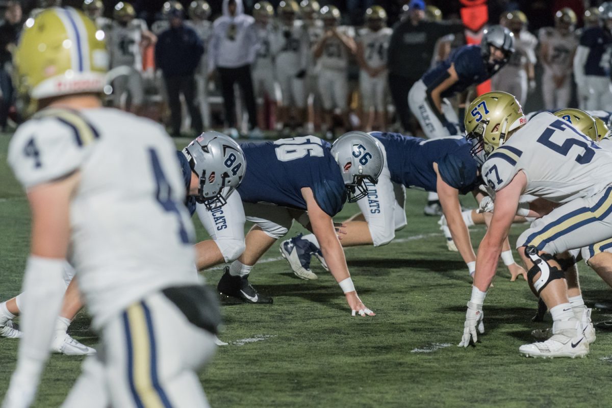 Mason Seal sits in a 3-point stance on defense in last weeks game against Canby. The Wildcat team went on to win 49-22. Photo provided by Greg Artman.