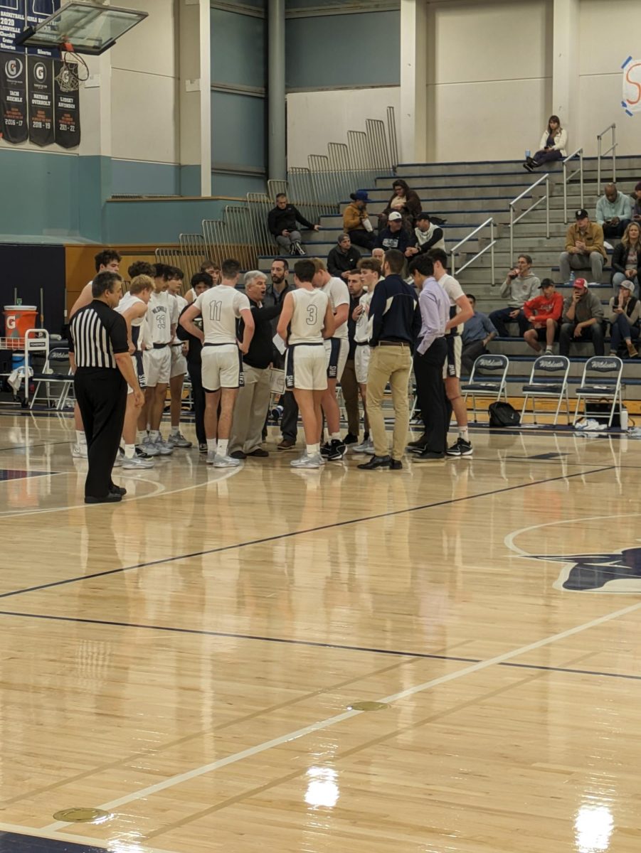Churchill came out of halftime with a strong offensive presence, forcing Wilsonville to call a quick timeout. Head coach Chris Roche pulls his team together and talks it over.