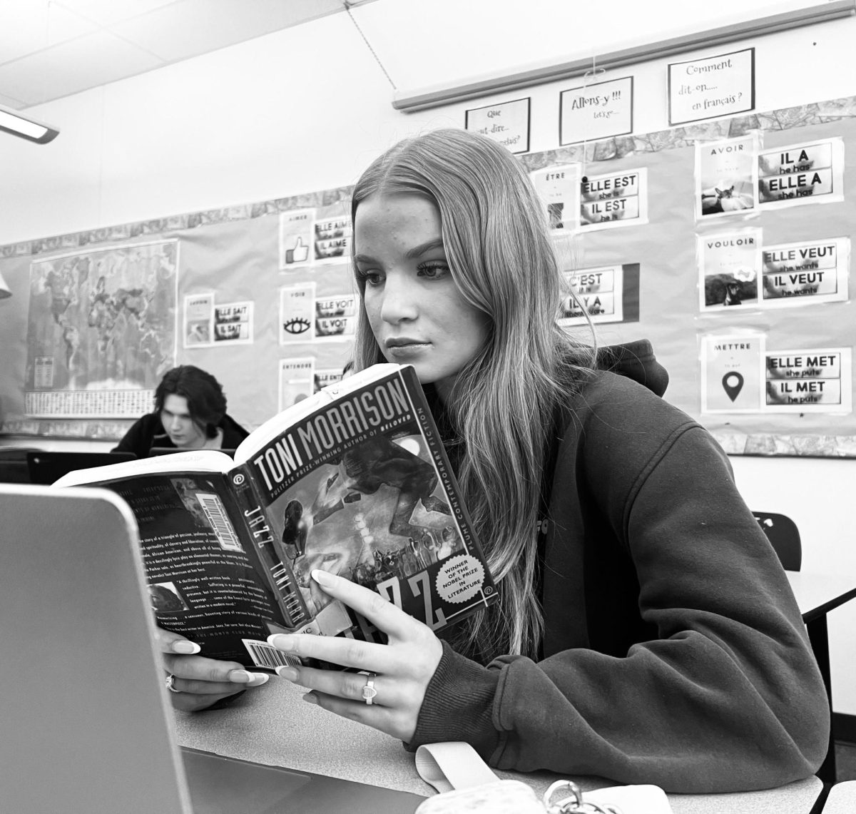 A studious Karli Sanders, junior, reads her book assignment. From the outside, one may think shes mindlessly reading, but in reality, she is following each word with excitement for whats to come.