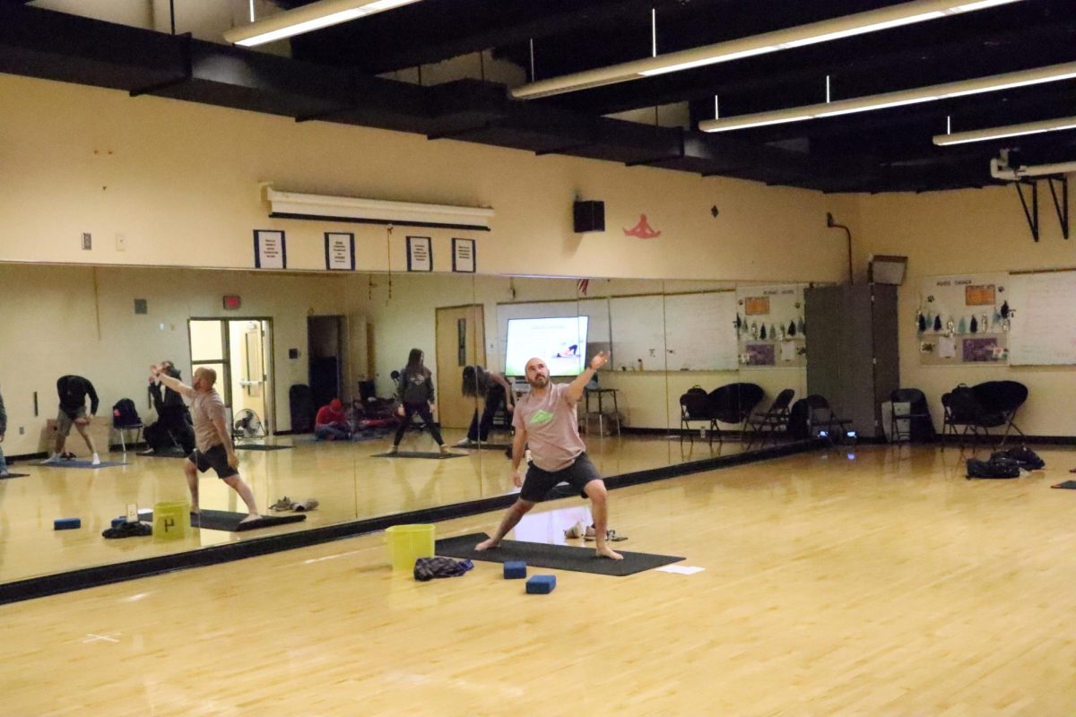 Jacob+Smeraglio+guides+students+through+their+daily+yoga+routine.+This+is+the+second+of+three+activities+the+class+participated+in+during+the+period%2C+starting+with+journaling+and+ending+with+games+in+the+Pointe.+Photo+provided+by+the+author.