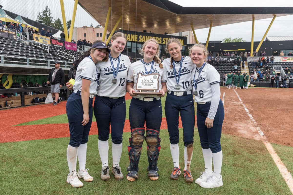 In+2022%2C+the+now-seniors+pose+with+the+OSAA+5A+second-place+trophy+after+making+history+for+the+Wilsonville+High+School+Softball+program.+Photo+provided+by+Greg+Artman.