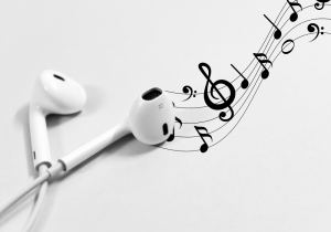 Music flows from the soul of an Apple earbud. The music could turn heads as it flows with elegance. 