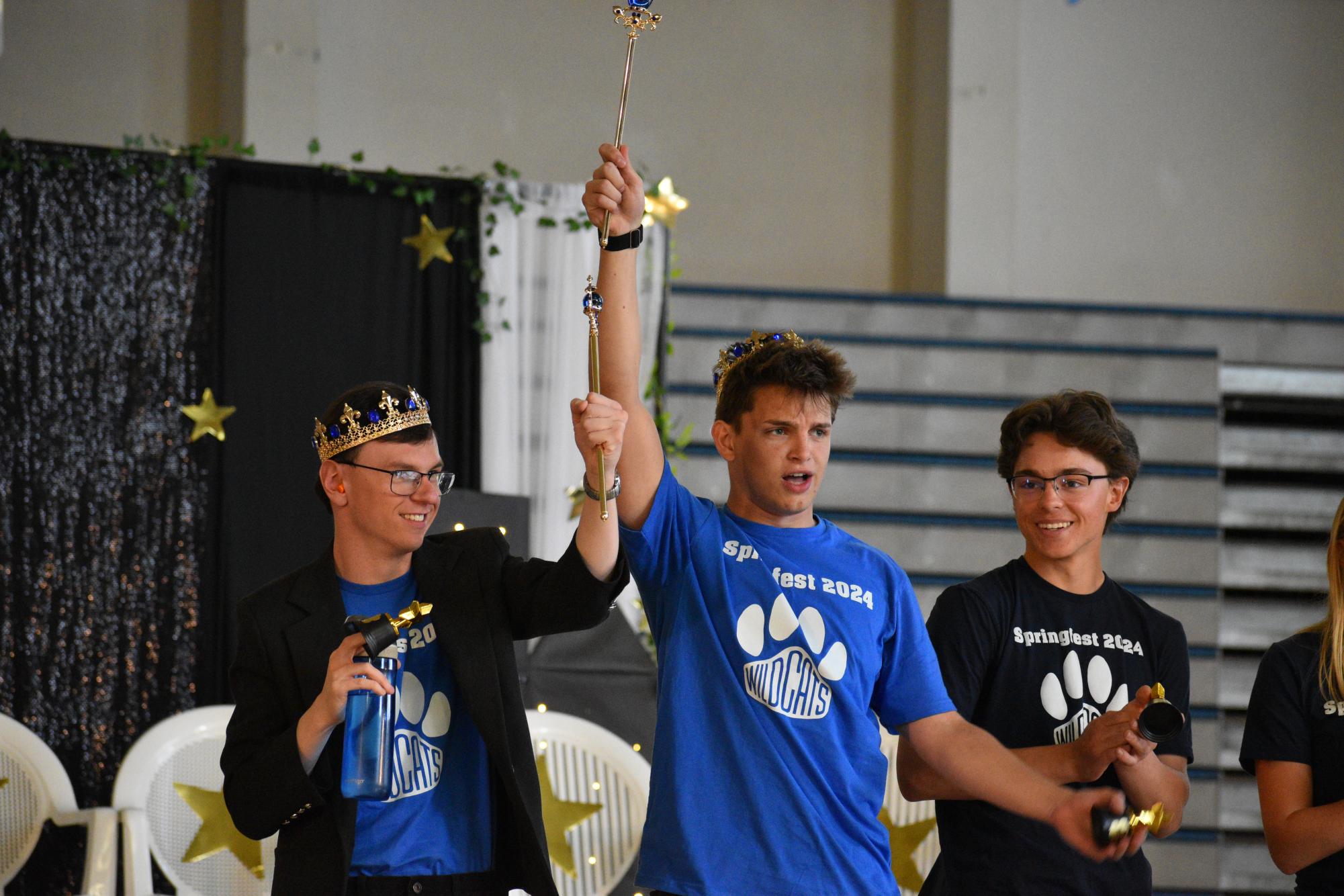 After being crowned, Halstead and McKnight hold their sceptors high. The pair were honored to win!