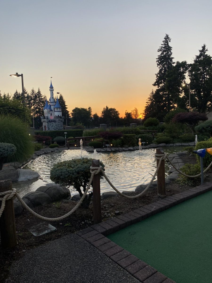 A summer sun sets over the mini golf course at Bullwinkles Family Fun Center. This location is a popular hub for working teenagers. 