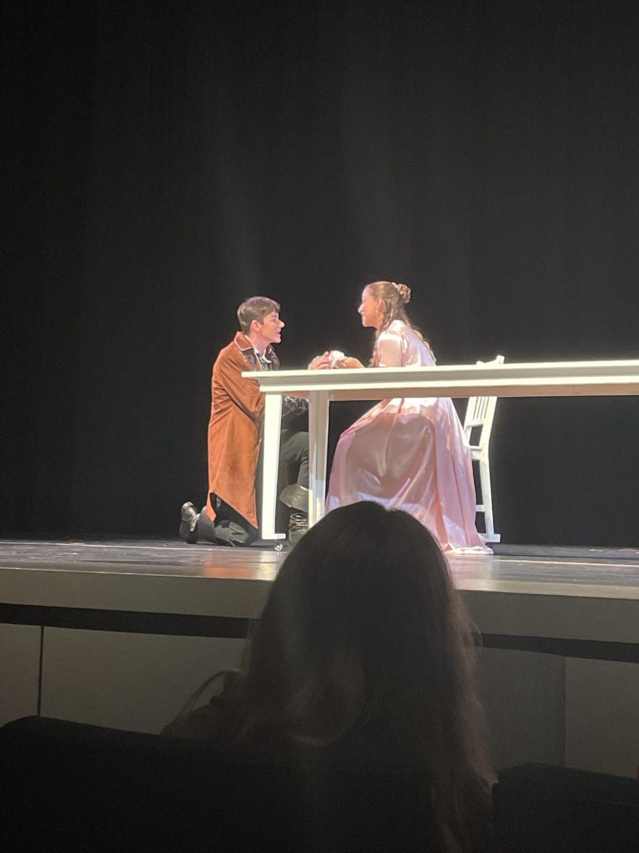 Actors Kate Gore and Axel Lauthner take the stage in their first scene together. The play hints that their characters could be love interests throughout the following scenes. 