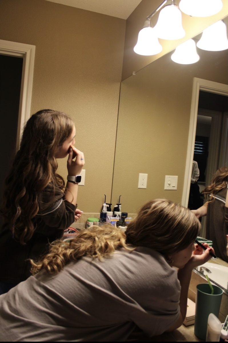 Two students enjoy the presence of each others company whilst getting ready. A lot of students at WVHS prefer getting ready amongst friends. Photo provided by Cassidy Shoffitt.