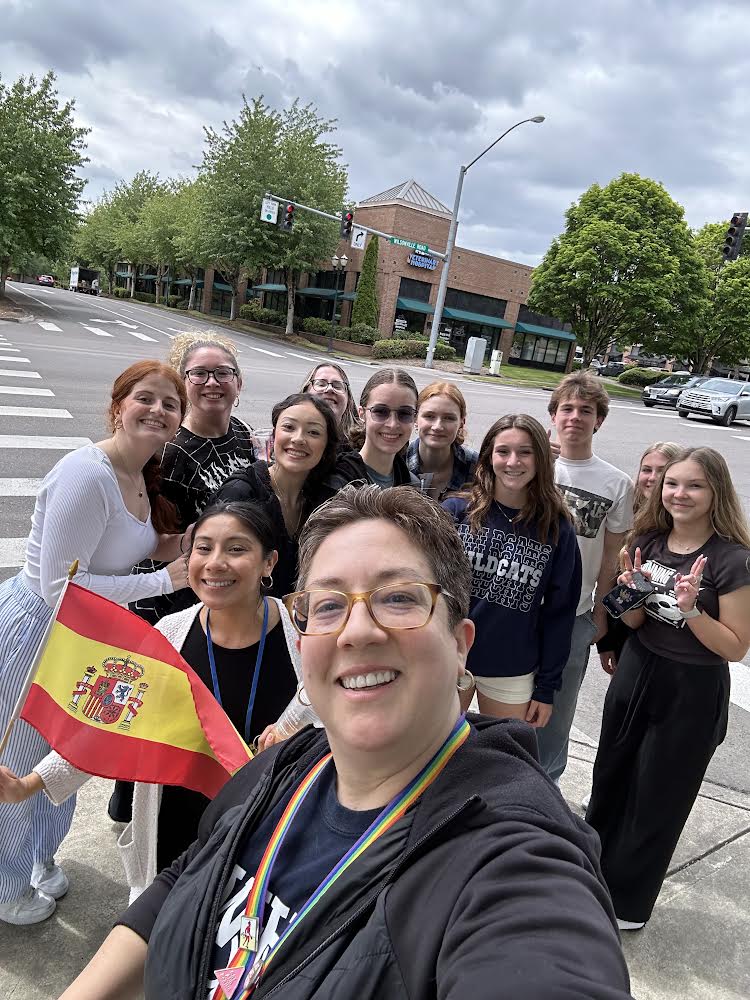 Ap Spanish students pose for a selfie with Mrs. Villalobos as they wait to cross the street on their way to the restaurant. Photo provided by Kathy Villalobos.