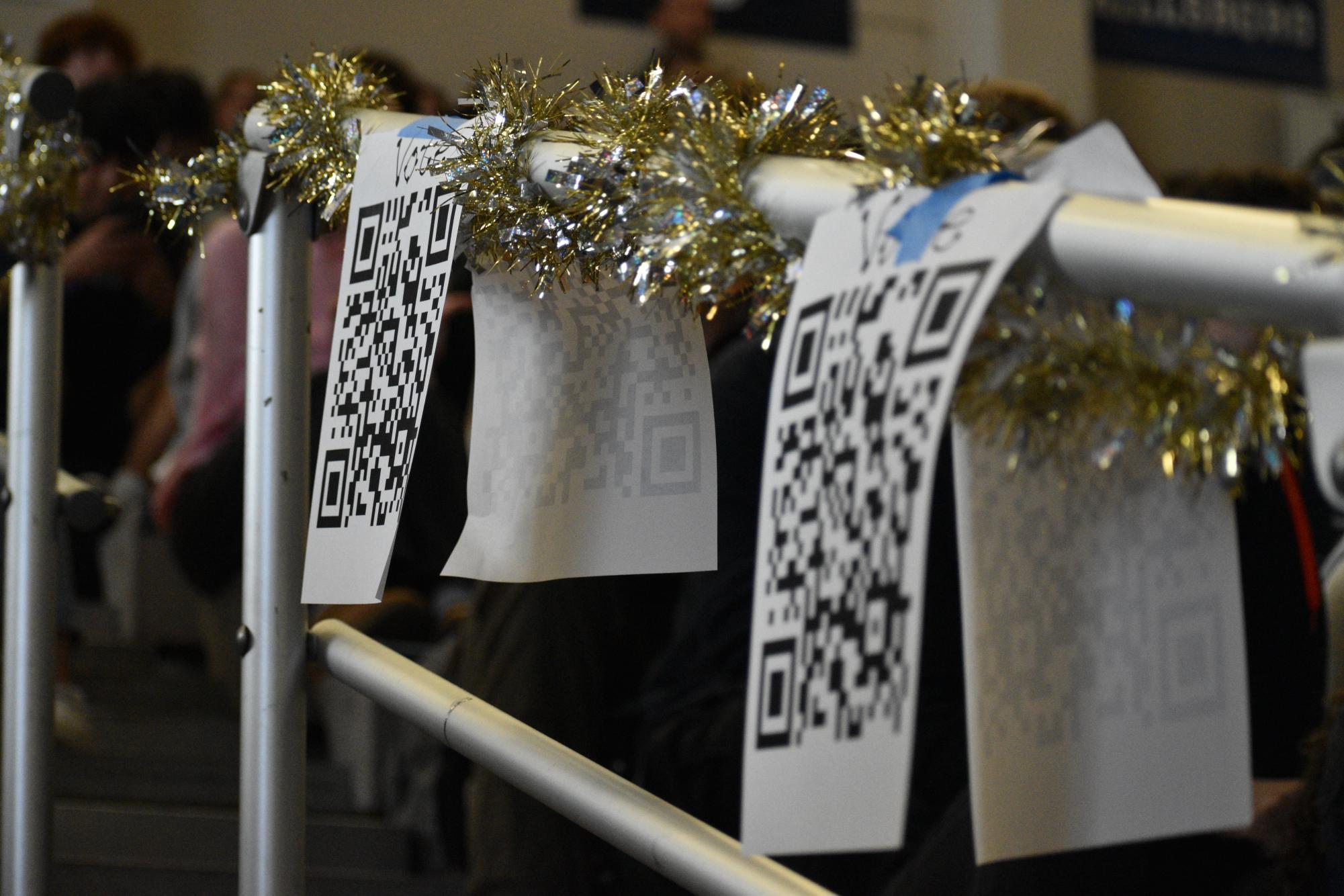 These QR code posters were hung all over the gym. Students scanned them at the conclusion of the talent portion.