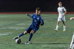 Alex Aguliar dribbling though defenders.
Alex Aguliar is going into his senior year and is the top striker for Wilsonville.