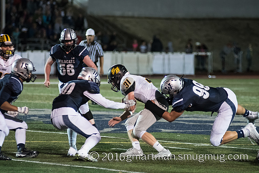 Draco Bynum takes down an opponent in this game against St. Helens.