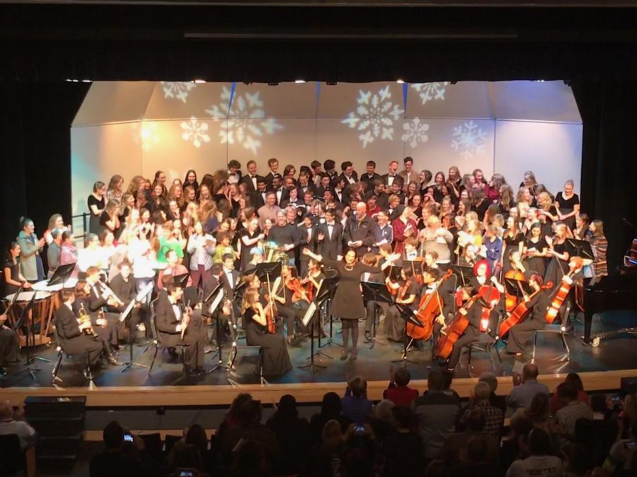 Director of Choirs, Annie Kubitschek, leads the bows after the finale.  Photo by Jason Katz.