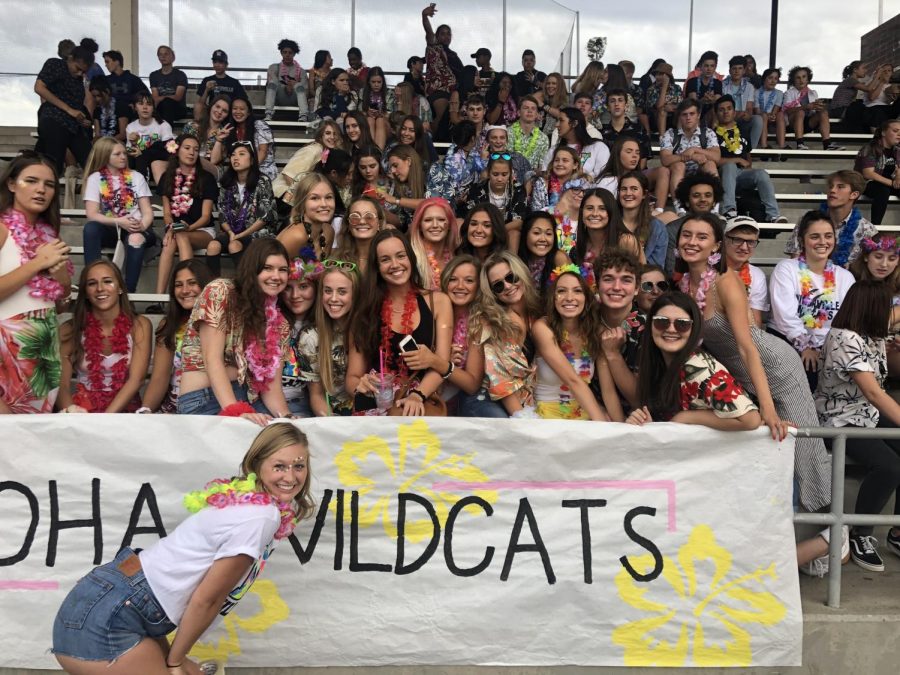 Fans prepare for  football game after the tailgate. 