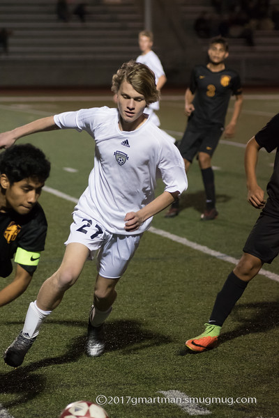 Junior Elijah Powlison pursues the ball in a varsity soccer game against Milwaukee.
