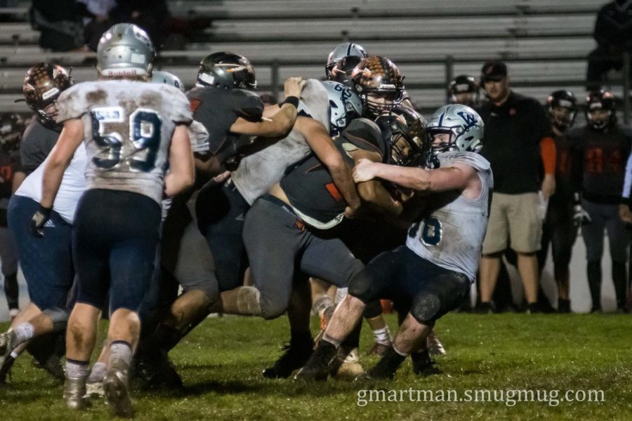 Senior Caleb Baker and Kalei Kauhi gang up to stuff Scappoose behind the line of scrimmage. On 3rd on long, the Indians were forced to punt after the tackle for a loss. 