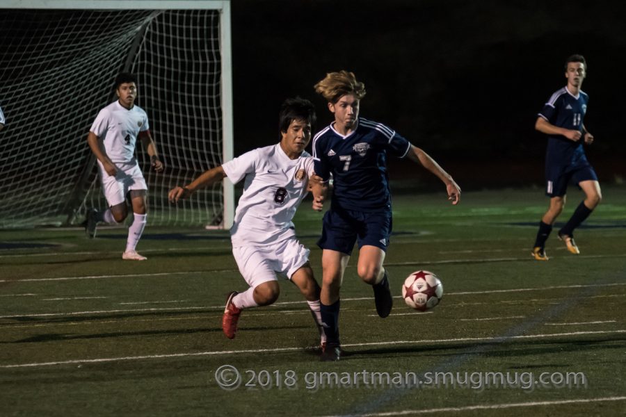 Senior Zach Gibson battling for the ball. Gibson said the team is looking froward to finishing the season strong.