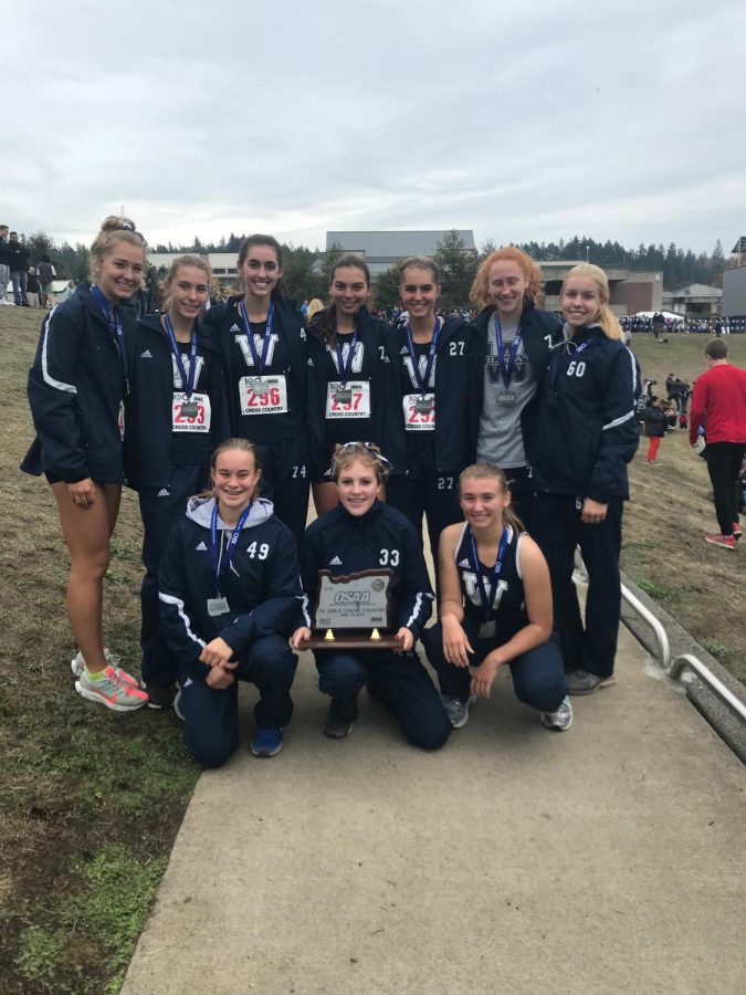 Wilsonville Cross Country girls pose with their second place trophy. We are so proud of how all the athletes performed at state!