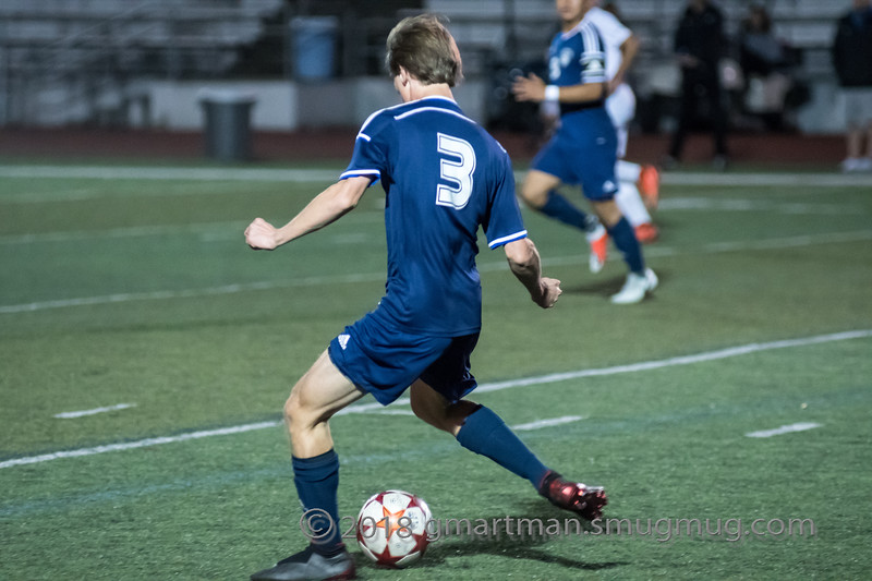 Ryan McCord passes the ball to his teammate. 