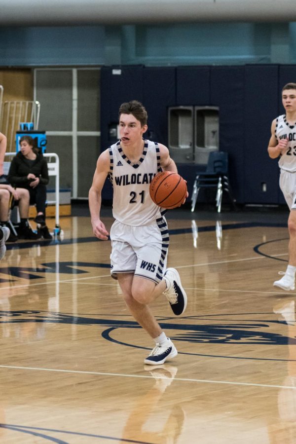 Andrew Classen dribbles the ball down the court in an earlier game against St. Helens