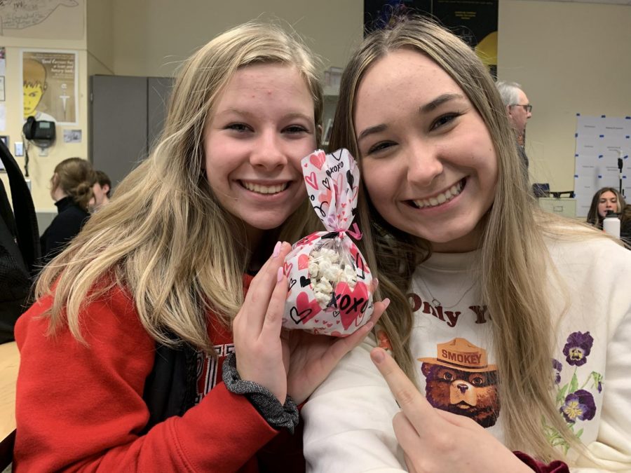 Juniors Meghann Yochim and Aly Johnston celebrate Valentine's Day with a treat.