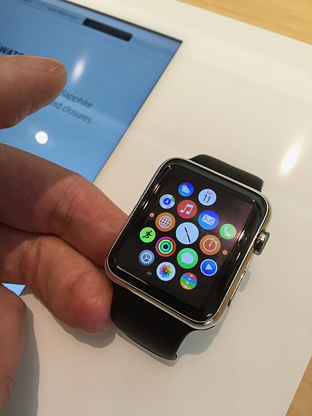 A user admires his apple watch