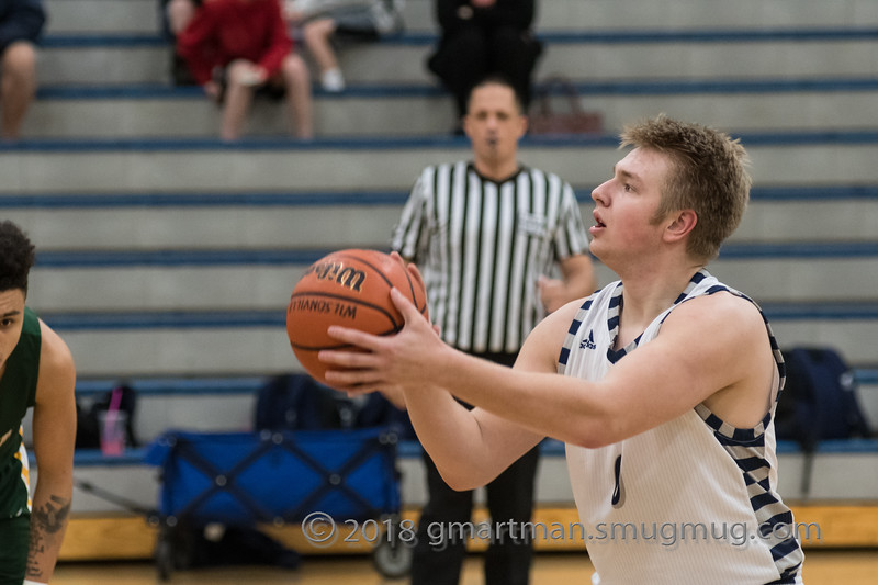 Senior Zach Rosetti measures up a foul shot.  Rosetti was the top scorer against Milwaukie tonight.