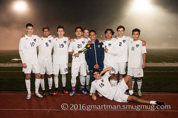 Seniors pose by the field after defeating Parkrose 6-0.