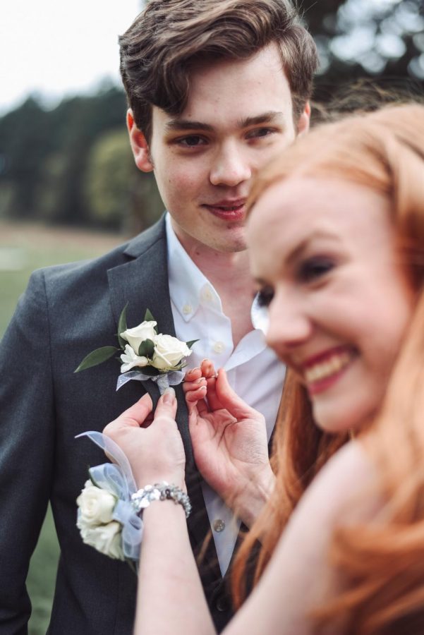 Juniors Mikaela Ochocki and Casey Young taking their prom photos. The photo above is a candid. Photo credit Jake Young Photography.