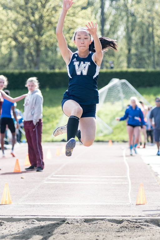 Senior Kellie Yoshida competing in the long jump. She won both the long and triple jump on Wednesday against Milwaukie.