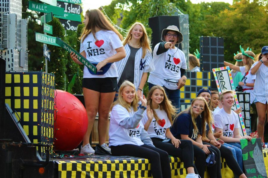 The sophomore class poses for a picture before they walk in the parade. There theme this year was New York.