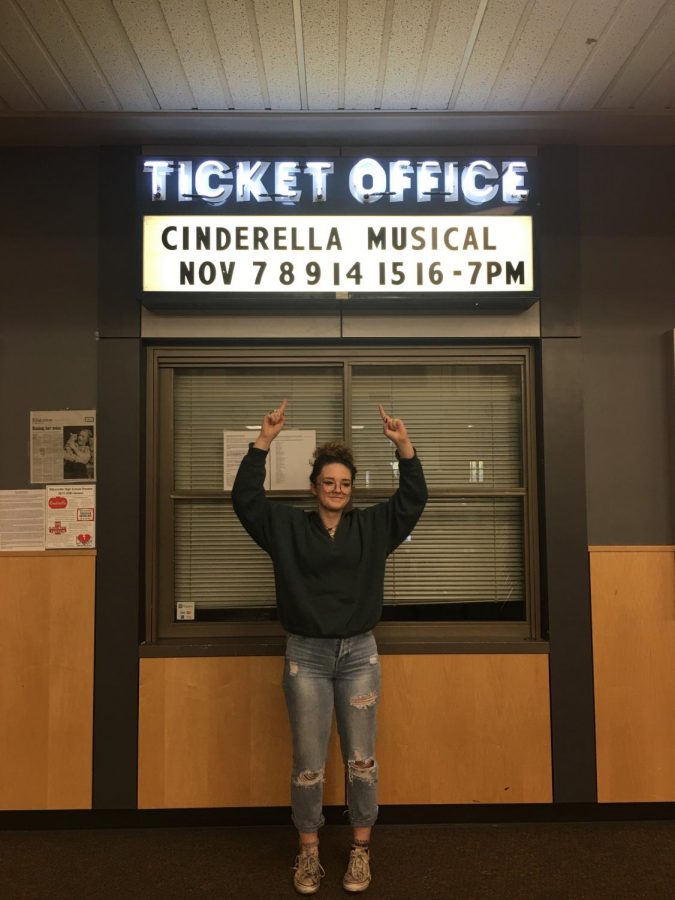 Pictured above is ensemble member Kate Hedgepeth presenting the showtimes for this fall's musical Cinderella.