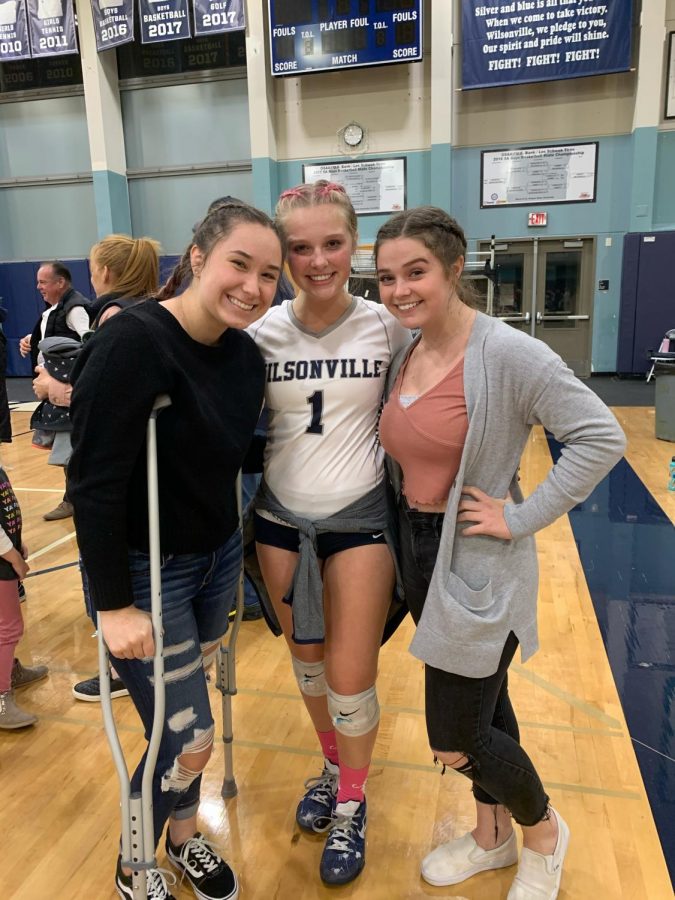 Senior captain & libero Gracie Thompson with Alyson Johnston and Jackie Foltz after Tuesday's win over La Salle.