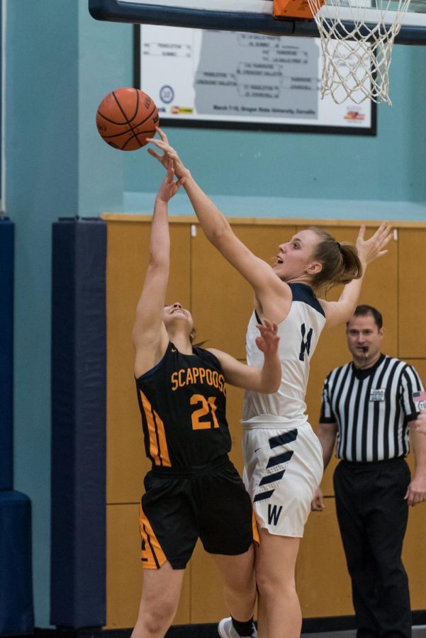 Junior Emi Bishop blocks a shot. The Wildcats held Scappoose under 50 points.