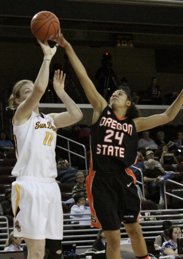 Alyssa Martin blocks a shot from an Arizona State player in the 2011 Pac-12 Tournament. 2011 was Scott Rueck's first of ten years at Oregon State.