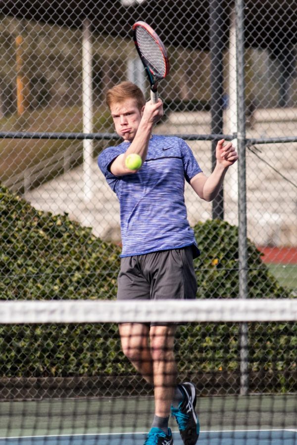  Nate Ogden returns the ball in a 2019 match vs Hillsboro.