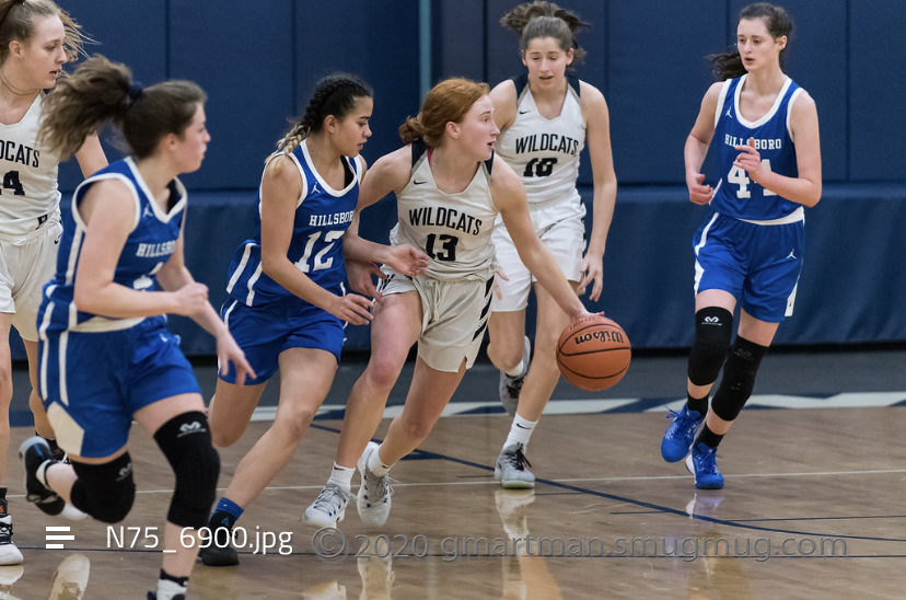 Burns (13) in offensive play against Hillsboro.