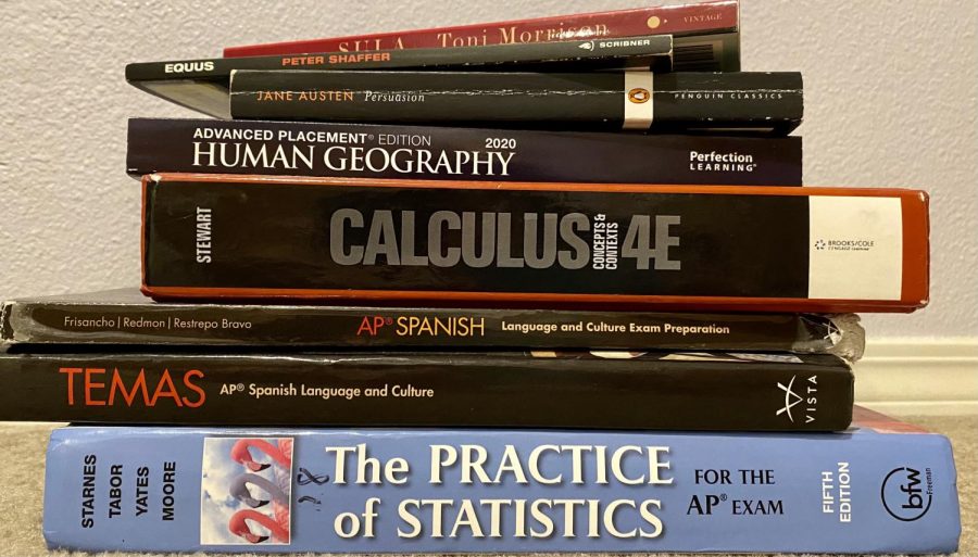 Maura Schramm's stack of AP materials that she is using to prepare for 
AP tests. Students need to balance all these classes during their off quarter in order to pass their AP tests come spring. 