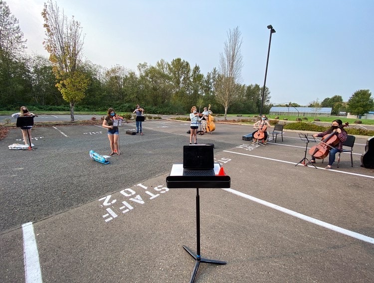 Kyra Allen plays first violin in Chamber Orchestra. Over the summer the orchestra used the high school parking lot in order to  practice socially distanced. 