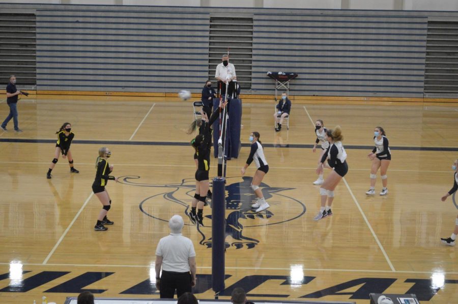 Klein spikes the ball during the second set. The Wildcats won the game in three sets.