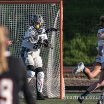 Chloe Robinson stops a shot on goal from aggressive Pioneer/Cav attackers.