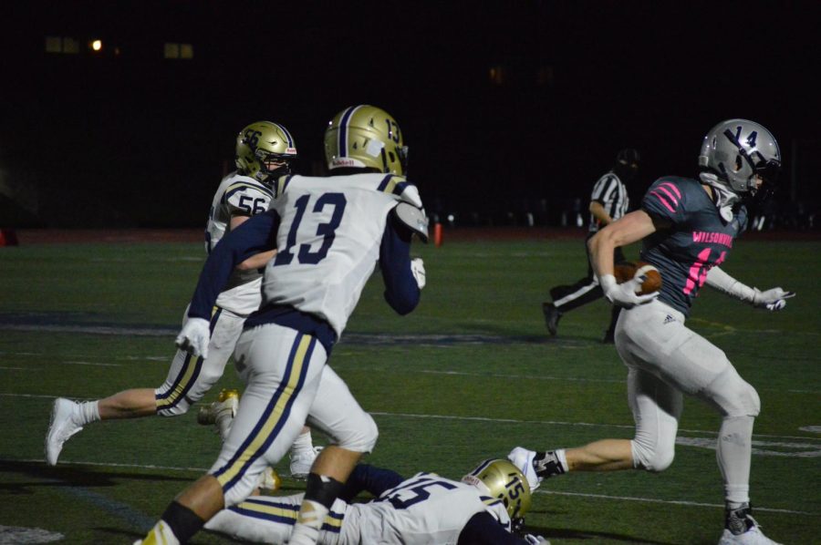 Senior Riley Scanlan outruns Canby defense. The Wildcats won their game 37-14.