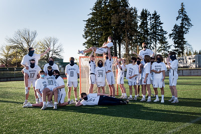 Boys lacrosse posing during a team shoot. They lost on Tuesday 16-6.